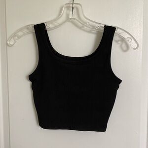 brown, black, and tan tank tops